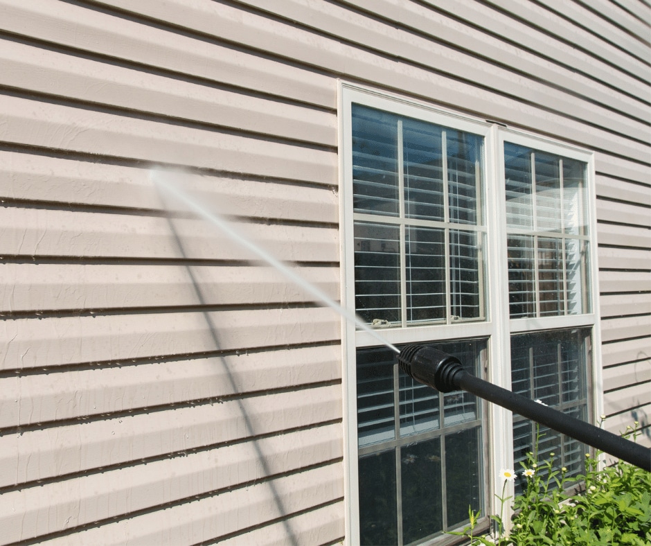 Pressure washing a house in McDonough Pressure washing a house